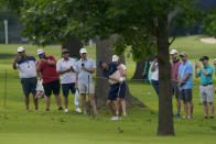 Fans watch as Jordan Spieth hits from the rough on the 14th hole during a practice round for the PGA Championship golf tournament, Tuesday, May 17, 2022, in Tulsa, Okla. (AP Photo/Matt York)