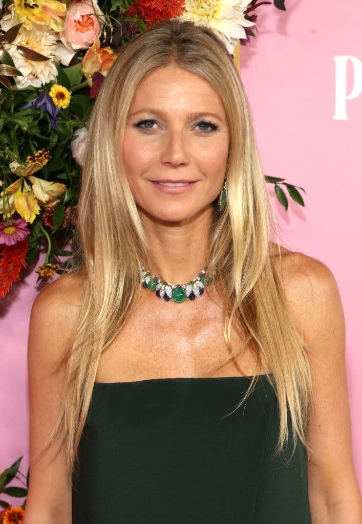 Gwyneth wearing a strapless top and necklace