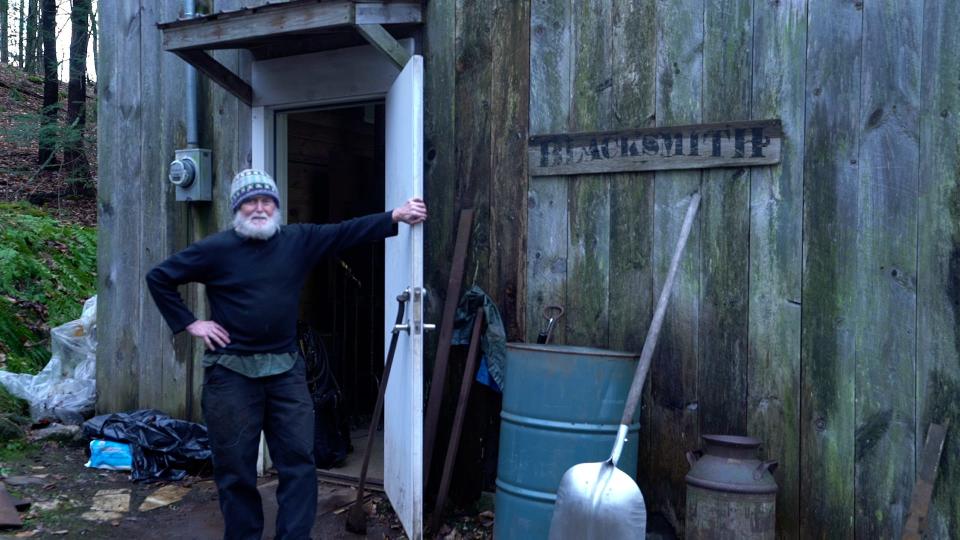 Blacksmith Michael Harrigan stands outside his shop in Charlotte on Jan 5., 2023.