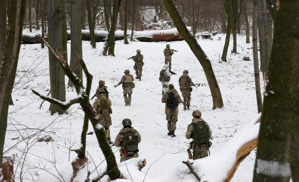 Members of Ukraine's Territorial Defense Forces, volunteer military units of the armed forces, train in a city park in Kyiv, Ukraine, on Jan. 22, 2022. Dozens of civilians have been joining Ukraine's army reserves in recent weeks amid fears about Russian invasion.