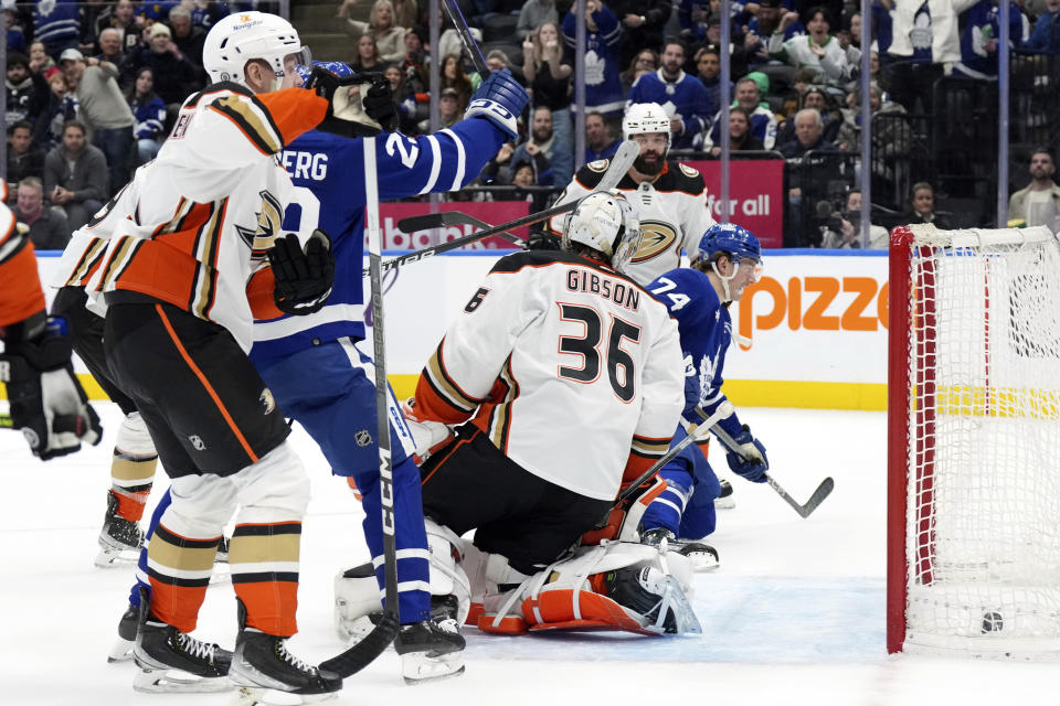 Toronto Maple Leafs' Bobby McMann (74) scores against Anaheim Ducks goaltender John Gibson during the second period of an NHL hockey game, Saturday, Feb. 17, 2024 in Toronto. (Chris Young/The Canadian Press via AP)