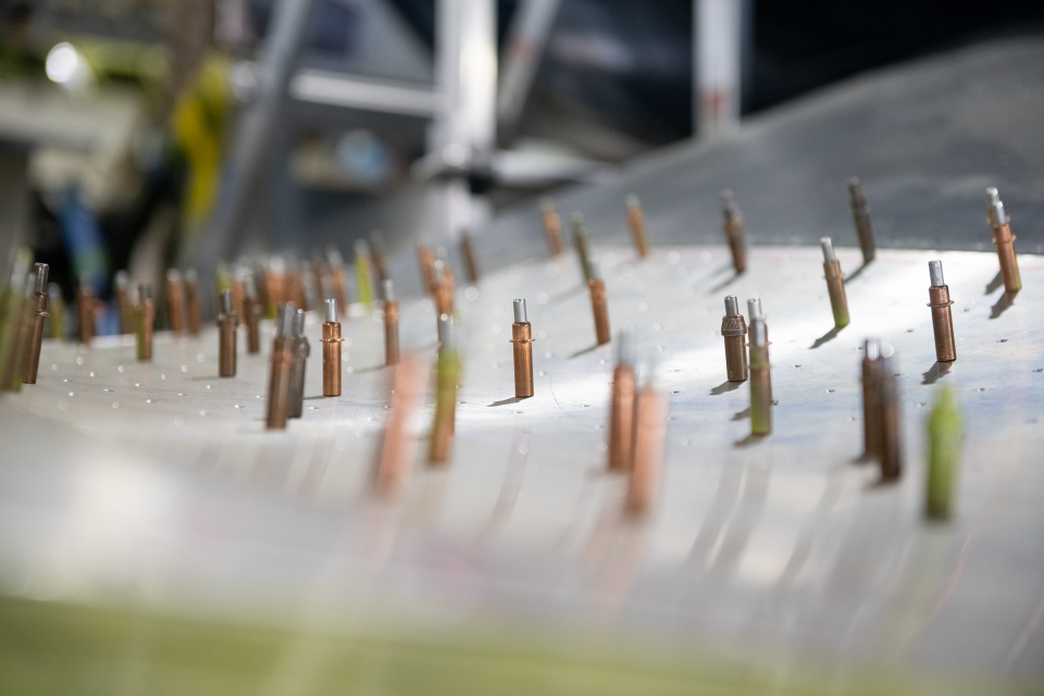 Cleco fasteners are arranged on the inner wing of the Goodyear Corsair at the MAPS Air Museum.