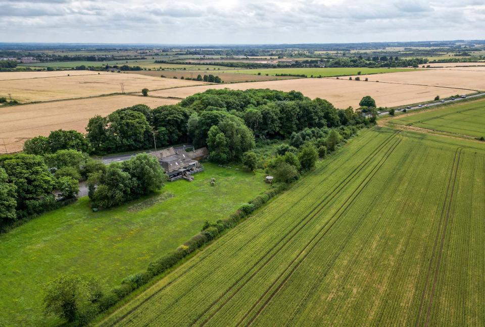 The Windmill pub pictured surrounded by natural beauty