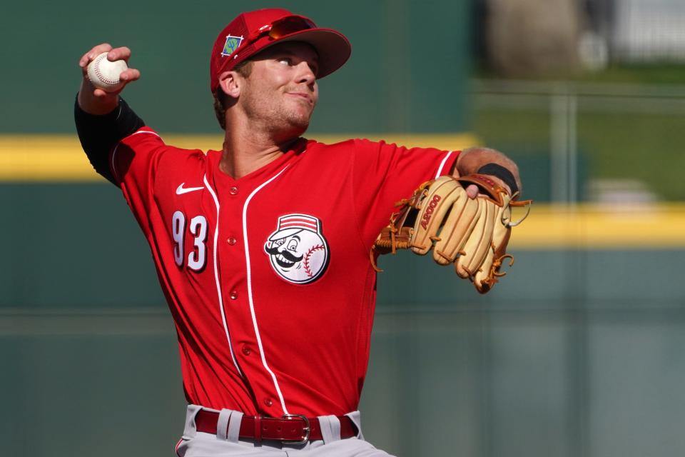 Reds prospect Matt McLain throws to first base for an out during a spring training game against the Cleveland Guardians in March.