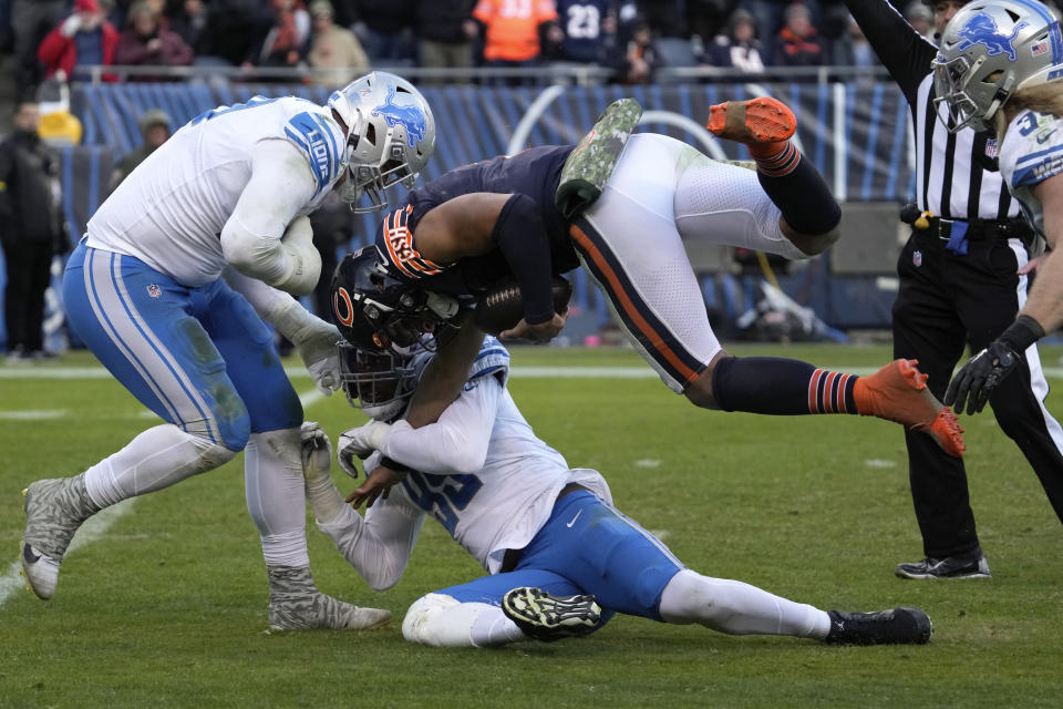 Detroit Lions linebacker Julian Okwara (99) sacks Chicago Bears quarterback Justin Fields (1) during the second half of an NFL football game in Chicago, Sunday, Nov. 13, 2022. (AP Photo/Nam Y. Huh)