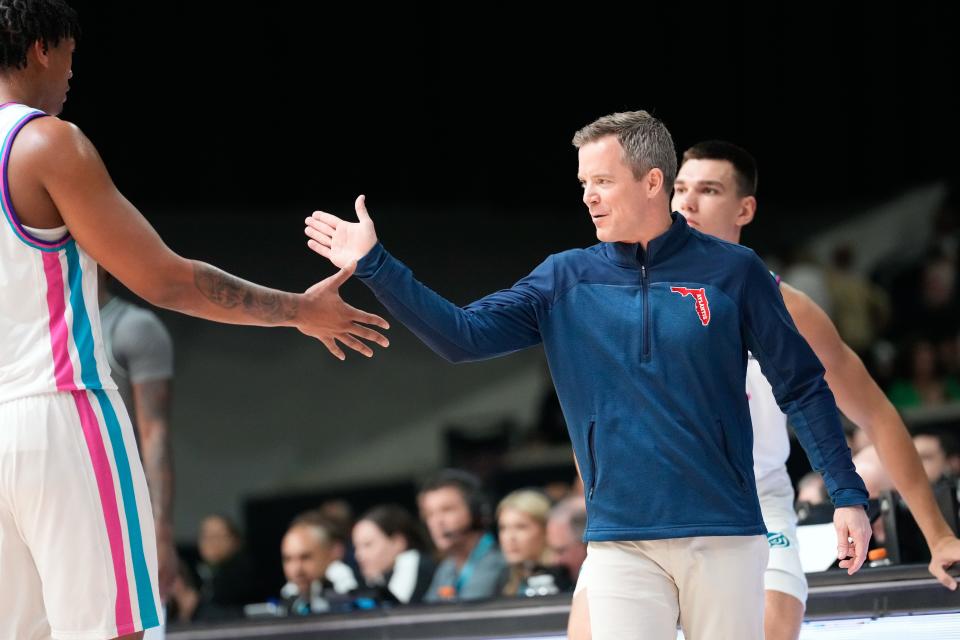 Mar 11, 2023; Frisco, TX, USA;  Florida Atlantic Owls head coach Dusty May celebrates with Florida Atlantic Owls forward Giancarlo Rosado (3) after a play against the UAB Blazers during the first half at Ford Center at The Star. Mandatory Credit: Chris Jones-USA TODAY Sports