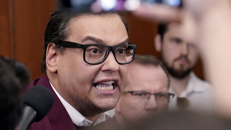 Rep. George Santos, R-N.Y., talks to reporters at the Capitol in Washington on Oct. 13, 2023. Santos faced a vote late Wednesday, Nov. 1, 2023, to expel him from the House.