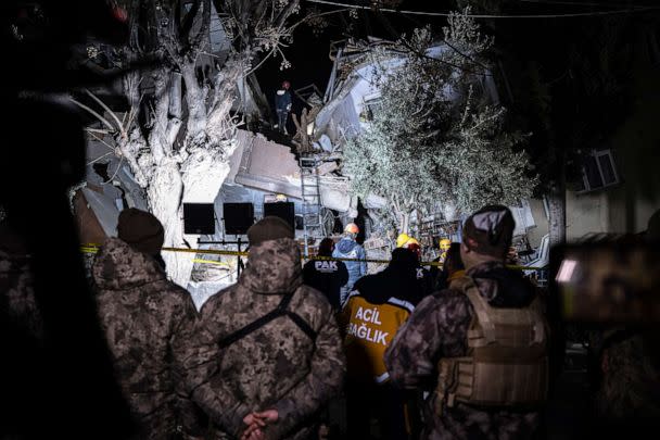 PHOTO: Rescue team members search for people in a destroyed building during the aftermath of an earthquake in Hatay, Turkey, Monday, Feb. 20, 2023. (Ugur Yildirim/AP)