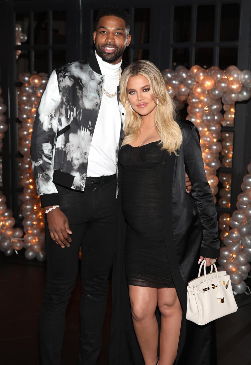 Tristan Thompson and Khloe Kardashian pose for a photo as Remy Martin celebrates Tristan Thompson's Birthday at Beauty & Essex on March 10, 2018 in Los Angeles, California