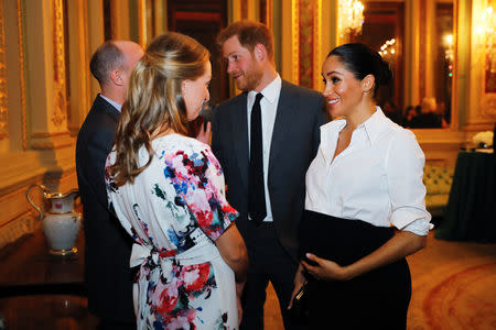 Britain's Prince Harry and Meghan, Duchess of Sussex, meet guests during a pre-ceremony reception before the Endeavour Fund Awards in the Drapers' Hall in London, Britain February 7, 2019. Tolga Akmen/Pool via REUTERS