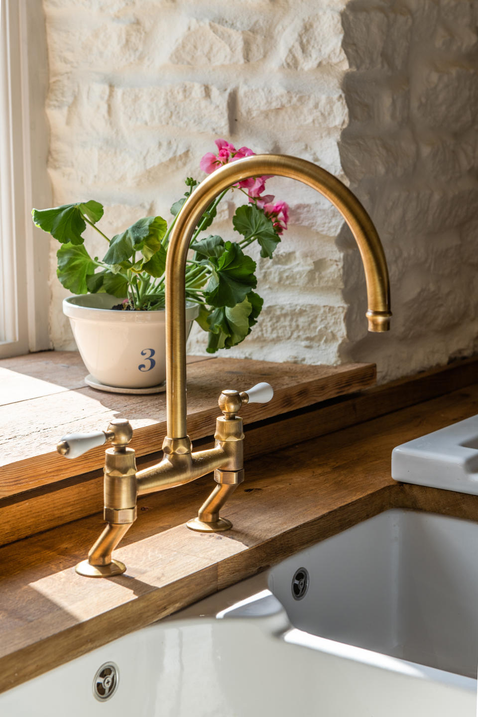 Integrated antique-style brassware for added warmth