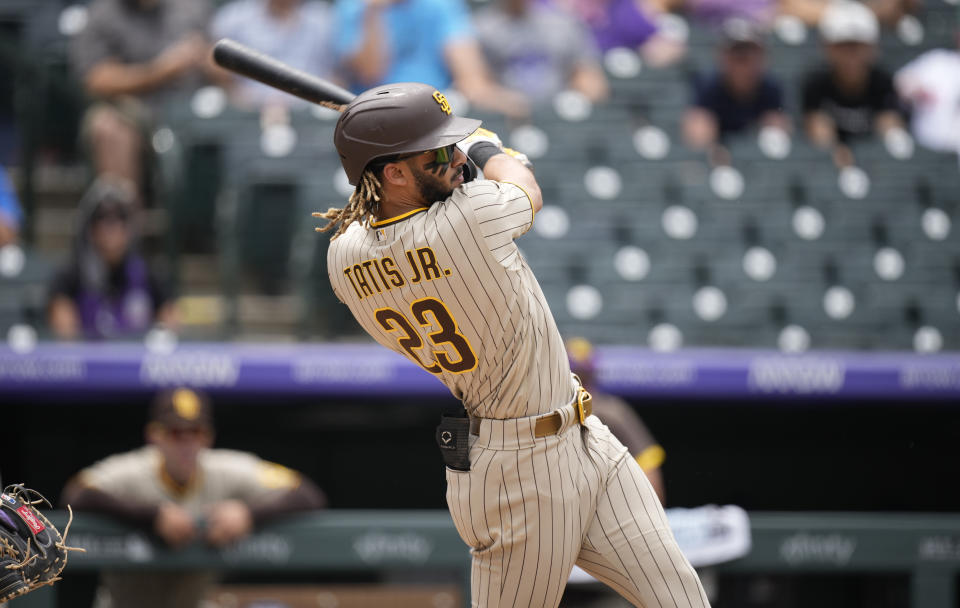 San Diego Padres' Fernando Tatis Jr. connects for a solo home run in the third inning of a baseball game Wednesday, June 16, 2021, in Denver. (AP Photo/David Zalubowski)