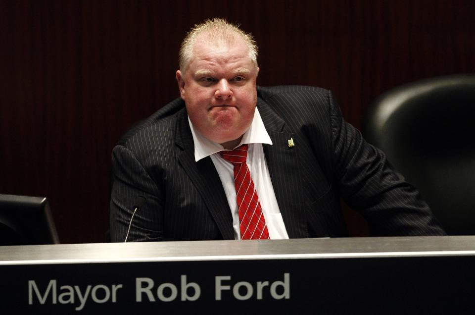 Toronto Mayor Rob Ford shown during a special council meeting at City Hall in Toronto November 18, 2013. The Toronto city council may further curb the powers of embattled Mayor Rob Ford on Monday, slashing his office budget and offering his staff a chance to transfer to new jobs. REUTERS/Aaron Harris (CANADA - Tags: POLITICS)