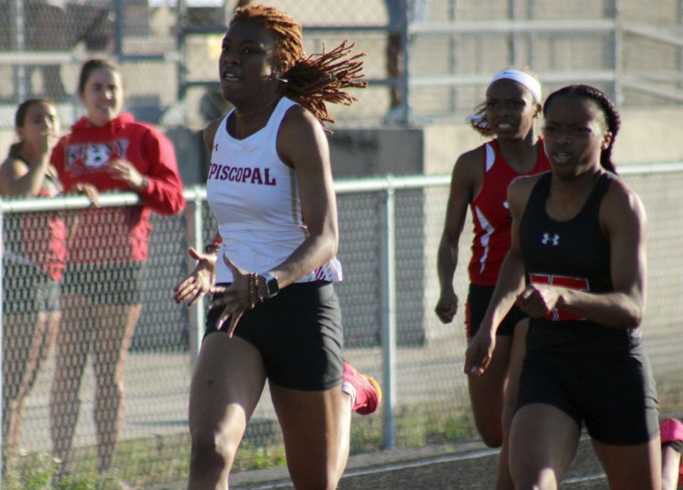 From left, Episcopal's Skyler Watts, Jackson's Kaitlynn Webbe and Bishop Kenny's Ka'Myya Haywood race to the line in the girls 400.