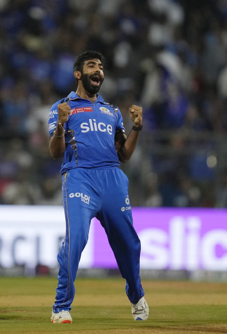 Mumbai Indians' Jasprit Bumrah celebrates the wicket of Royal Challengers Bengaluru's Virat Kohli during Indian Premier League cricket match between Mumbai Indians and Royal Challengers Bangaluru, in Mumbai, India, Thursday, April 11, 2024. (AP Photo/Rajanish Kakade)