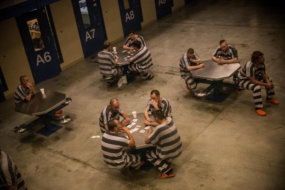 <div class="inline-image__caption"><p>Inmates sit in the county jail on July 26, 2013, in Williston, North Dakota.</p></div> <div class="inline-image__credit">Andrew Burton/Getty</div>