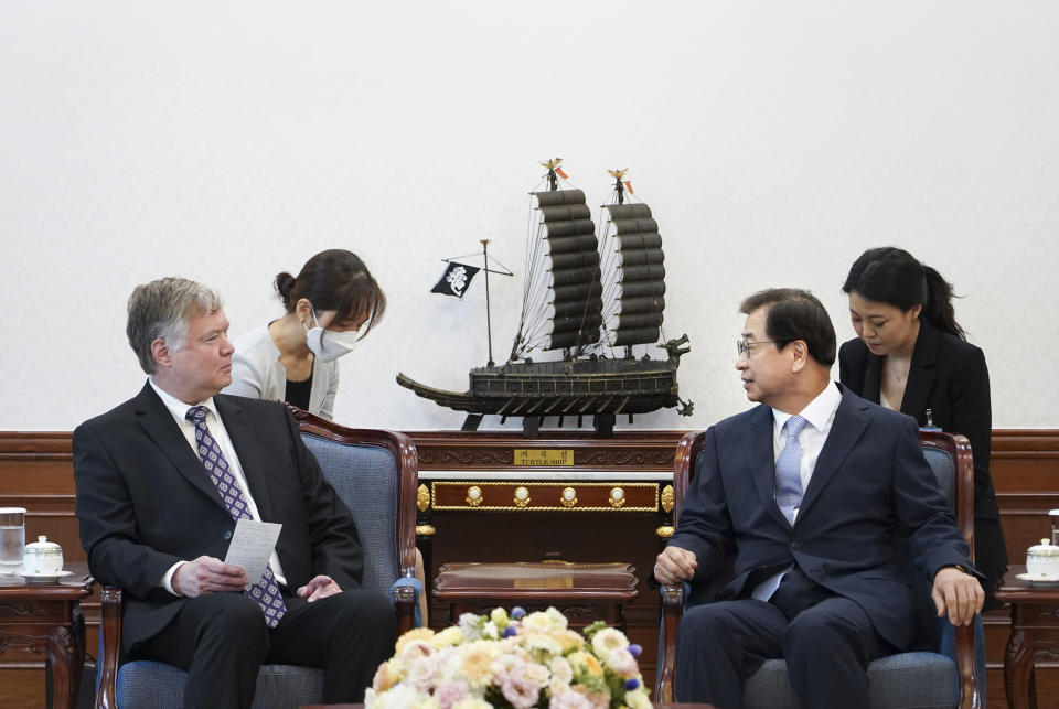 In this photo provided by South Korea Presidential Blue House, U.S. Deputy Secretary of State Stephen Biegun, left, talks with South Korean Presidential National Security Adviser Suh Hoon during a meeting at the presidential Blue House in Seoul, South Korea, Thursday, July 9, 2020. (South Korea Presidential Blue House via AP)