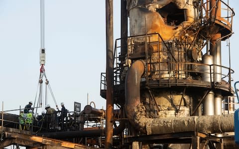 There was visible damage caused to Abqaiq plant's oil stablised columns, caused either by a missile or a drone strike  - Credit: Julian Simmonds for The Telegraph