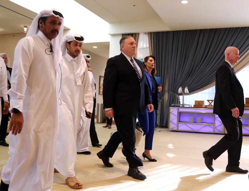 U.S. Secretary of State Pompeo walks ahead of the signing of an agreement between members of Afghanistan's Taliban delegation and U.S. in Doha