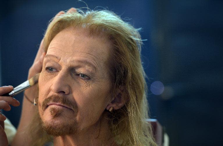 American actor Ted Neeley gets a makeup touchup during rehearsal for the show "Jesus Christ Superstar" on April 11, 2014 in Rome