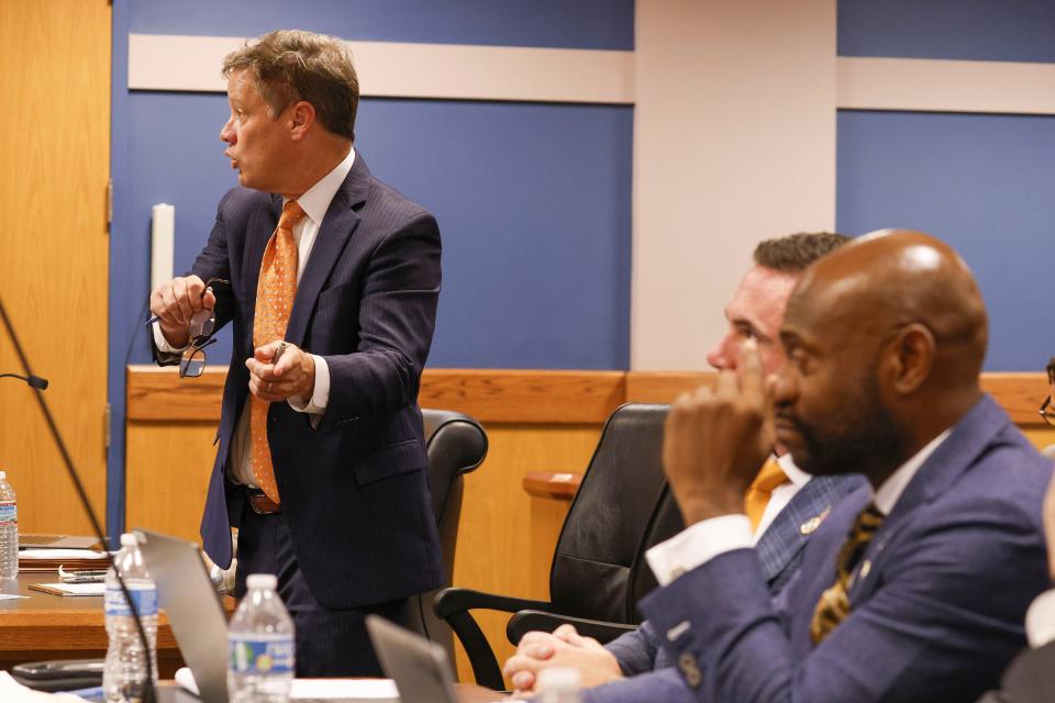 Brian Rafferty, left, attorney for Sidney Powell, gestures towards Special Prosecutor Nathan Wade, right, during a motions hearing in front of Fulton County Superior Court Judge Scott McAfee in Atlanta, Thursday, Oct. 5, 2023. Nineteen people, including former President Donald Trump, were indicted in August and accused of participating in a wide-ranging illegal scheme to overturn the results of the 2020 presidential election. (Erik S. Lesser/Pool Photo, via AP)