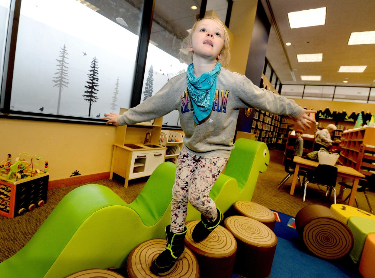 Hazel Higginbotham, 6, of Springfield plays in the children's section of the Lincoln Library in Springfield Wednesday Jan. 25, 2023.