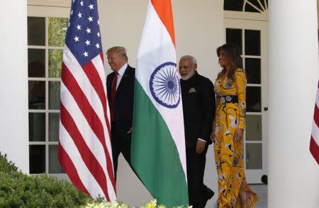 U.S. President Donald Trump (L) and first lady Melania Trump welcome Indian Prime Minister Narendra Modi to the White House in Washington, U.S., June 26, 2017. REUTERS/Kevin Lamarque