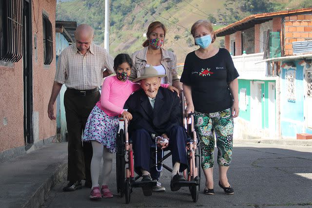 <p>Jorge Mantilla/NurPhoto via Getty</p> Juan Vicente with family, January 2022