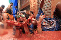 <p>Revelers enjoy as they throw tomatoes at each other, during the annual “Tomatina”, tomato fight fiesta, in the village of Bunol, 50 kilometers outside Valencia, Spain, Wednesday, Aug. 30, 2017. (Photo: Alberto Saiz/AP) </p>