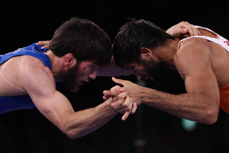 CHIBA, JAPAN - AUGUST 05: Zavur Uguev of Team ROC competes against Kumar Ravi of Team India during the Men's Freestyle 57kg Final on day thirteen of the Tokyo 2020 Olympic Games at Makuhari Messe Hall on August 05, 2021 in Chiba, Japan. (Photo by Maddie Meyer/Getty Images)