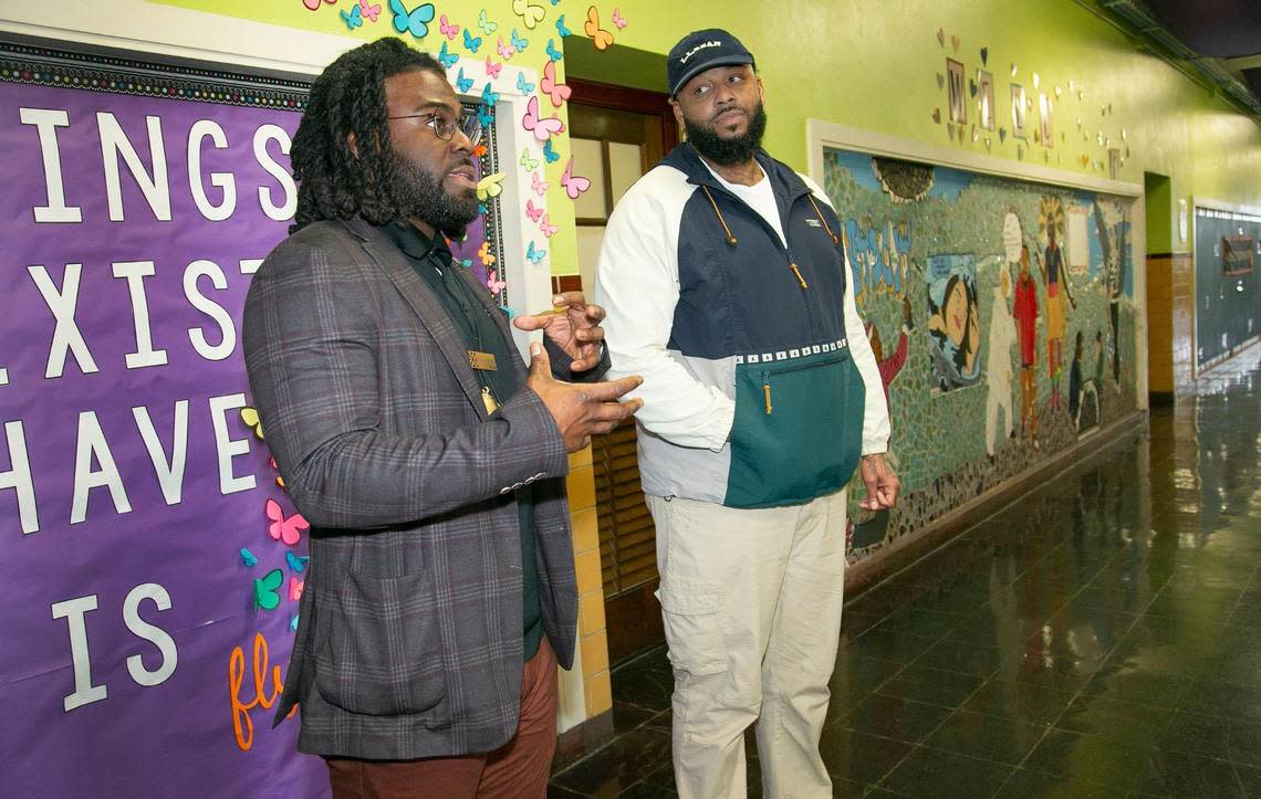 Cornell Ellis, (left) executive director of BLOC, which stands for Brothers Liberating Our Community, visited with science teacher Louis Lowe at De La Salle Education Center, 3737 Troost Ave, Kansas City, MO., lending support to Black male teachers in Kansas City schools. Susan Pfannmuller/ Special to The Star