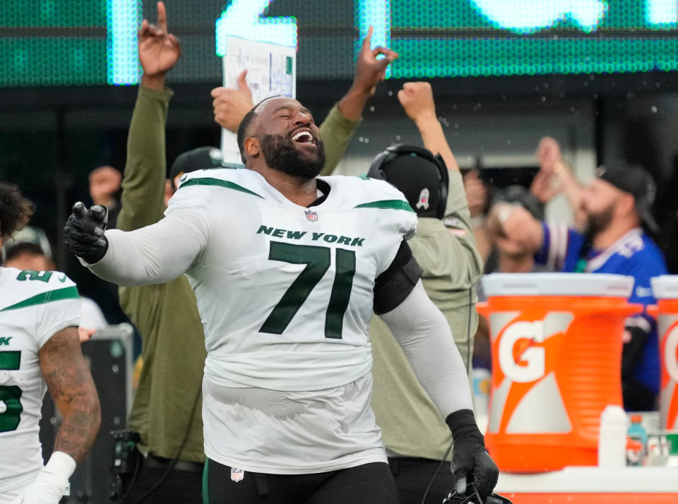 Nov 6, 2022; East Rutherford, NJ, USA;<br>New York Jets offensive tackle Duane Brown (71) celebrates the Jets taking over to ice the game in the 4th quarter against the Bills at MetLife Stadium. Mandatory Credit: Robert Deutsch-USA TODAY Sports