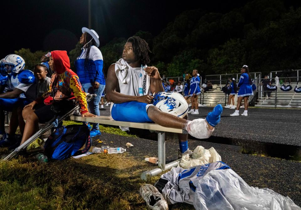 Pahokee running back Jenorris Wilcher Jr., sits on the bench with his ankle iced after being injured against Dwyer in Palm Beach Gardens, Florida on September 29, 2023.