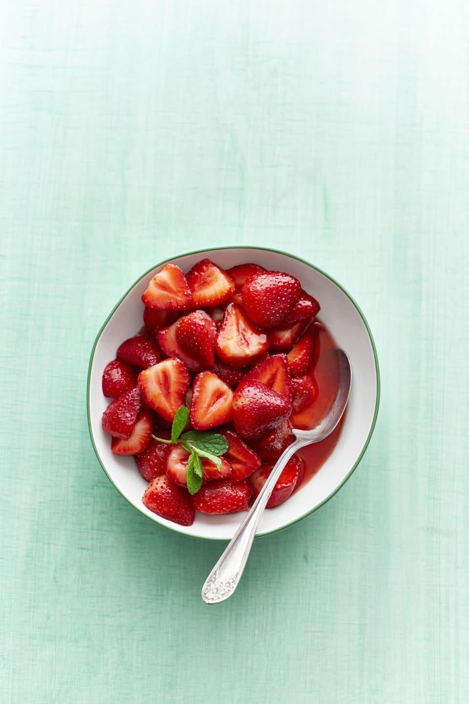 sweet strawberries in bowl with mint