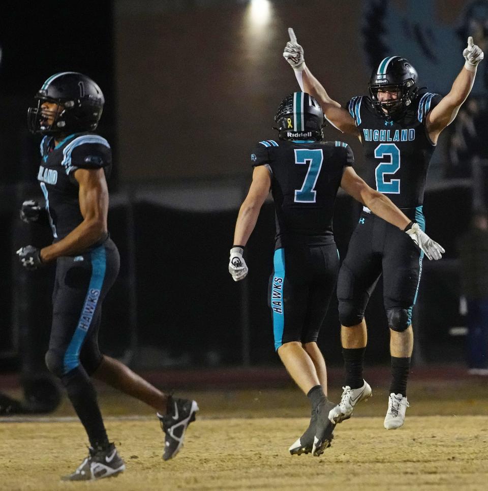 December 2, 2022; Gilbert, Ariz; USA; Highland safeties Joseph Allen (2) and Cole Crandall (7) celebrate Allen's game-clinching interception returned for a touchdown against Red Mountain during the 6A semfinal at Highland High School.