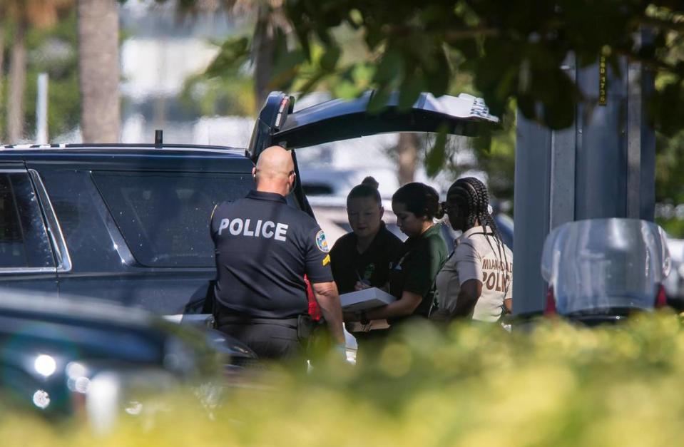 Police officers work a crime scene near 7920 East Dr. on Monday, Nov. 28, 2022, in North Bay Village, Fla. A man was killed, a woman was wounded and another man is in custody following a domestic-related shooting, authorities said.