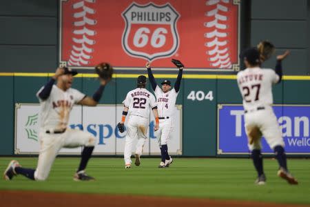 Oct 21, 2017; Houston, TX, USA; Houston Astros center fielder George Springer (4) celebrates with Houston Astros right fielder Josh Reddick (22) after defeating the New York Yankees in game seven of the 2017 ALCS playoff baseball series at Minute Maid Park. Thomas B. Shea-USA TODAY Sports