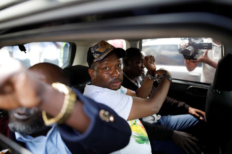 Nairobi's Governor Mike Sonko is escorted by police officers after his arrest, at the Wilson airport in Nairobi