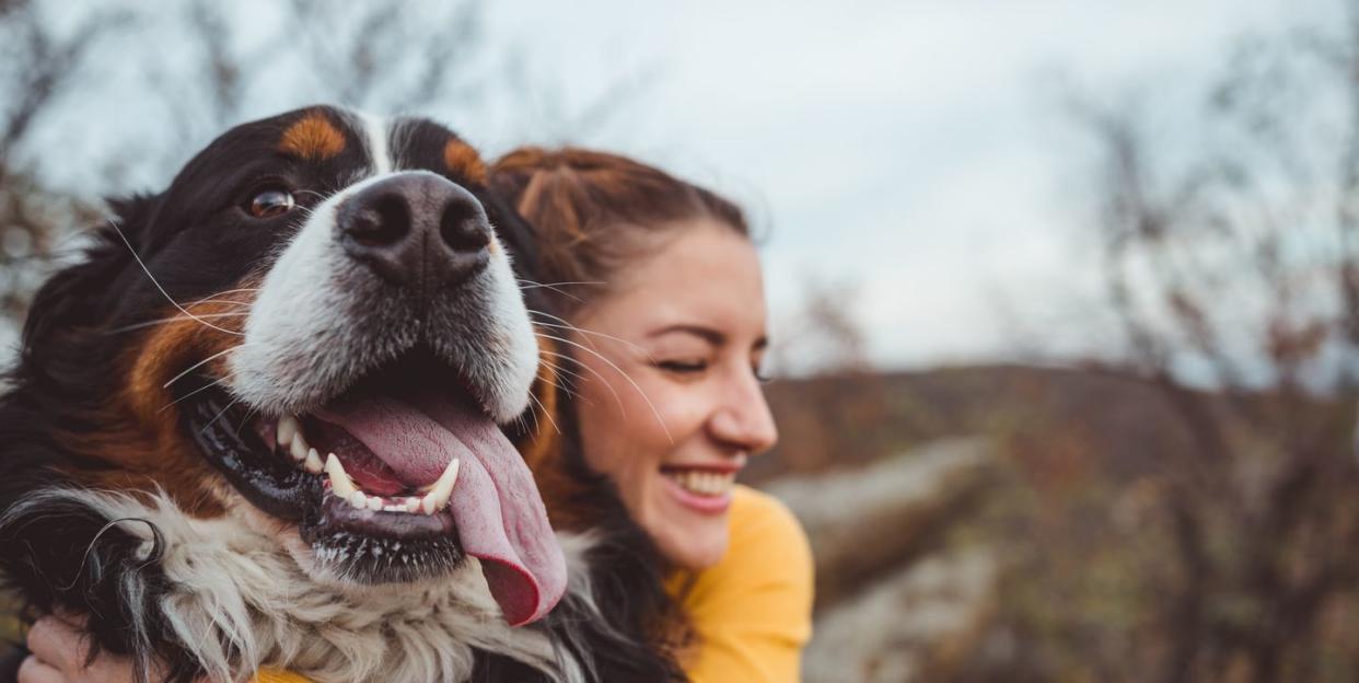 best dog perfumes young woman hugging her dog