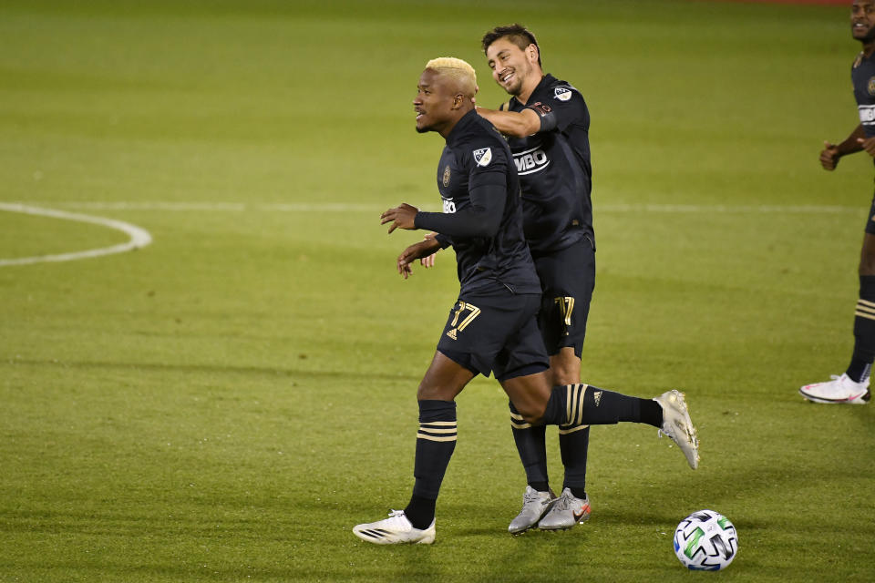 Philadelphia Union's Sergio Santos celebrates his goal with teammate Alejandro Bedoya, right, during the first half of an MLS soccer match against Toronto FC, Saturday, Oct. 3, 2020, in East Hartford, Conn. (AP Photo/Jessica Hill)