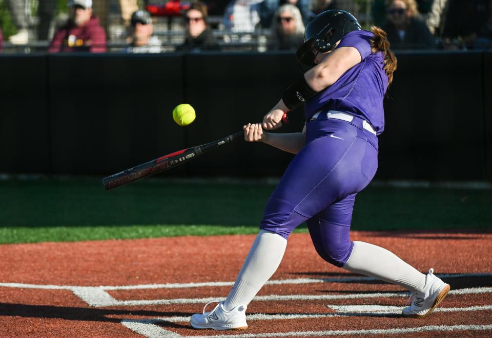 Bloomington South’s Abby Purtlebaugh hits a two-RBI single during the softball game against Bloomington North at South on Wednesday, April 24, 2024.