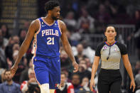 Philadelphia 76ers center Joel Embiid (21) argues with referee Ashley Moyer-Gleich during the first half of an NBA basketball game against the Cleveland Cavaliers, Wednesday, Nov. 30, 2022, in Cleveland. (AP Photo/Nick Cammett)