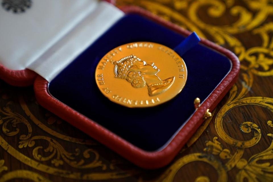 The Queen said the Queen’s Gold Medal for Poetry, which was presented to David Constantine, was ‘rather a nice medal’ (Kirsty O’Connor/PA) (PA Wire)