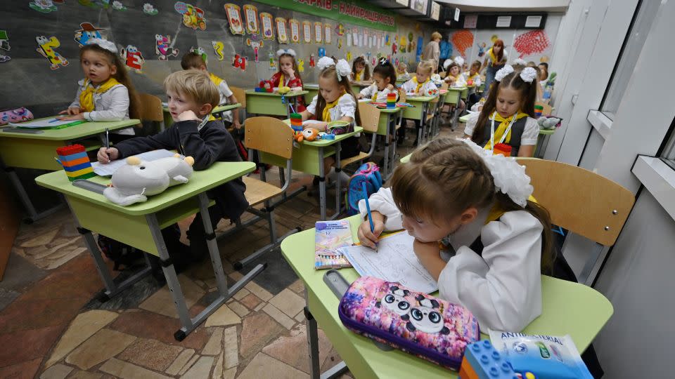 Pupils of the first grade attend a lesson in a classroom set up in a subway station in Kharkiv. - Sergey Bobok/AFP/Getty Images