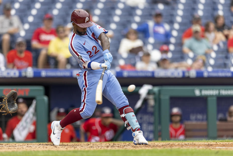 Philadelphia Phillies' Andrew McCutchen (22) hits an RBI single during the fifth inning of a baseball game against the Washington Nationals, Thursday, July 29, 2021, in Philadelphia in the second game of a doubleheader. (AP Photo/Laurence Kesterson)