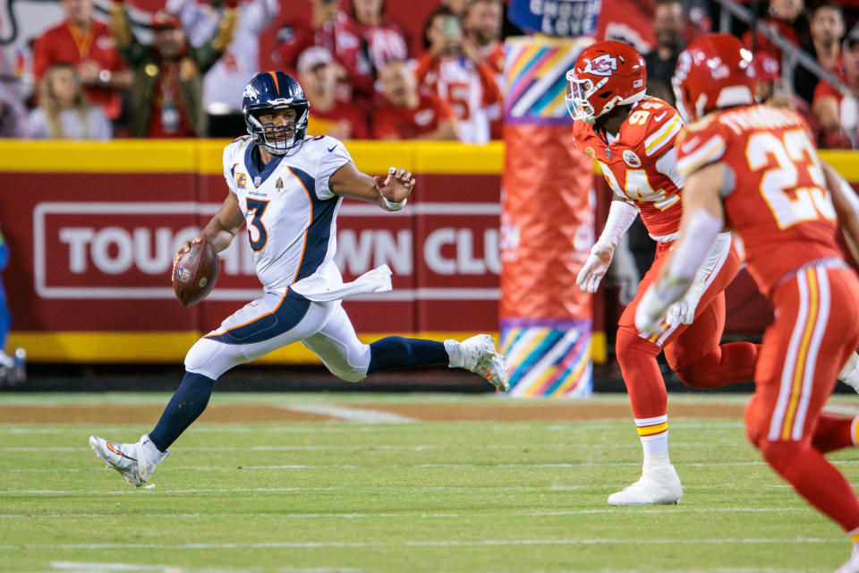 Oct 12, 2023; Kansas City, Missouri, USA; Denver Broncos quarterback Russell Wilson (3) scrambles in the backfield during the fourth quarter against the <a class="link " href="https://sports.yahoo.com/nfl/teams/kansas-city/" data-i13n="sec:content-canvas;subsec:anchor_text;elm:context_link" data-ylk="slk:Kansas City Chiefs;sec:content-canvas;subsec:anchor_text;elm:context_link;itc:0">Kansas City Chiefs</a> at GEHA Field at Arrowhead Stadium. Mandatory Credit: William Purnell-USA TODAY Sports