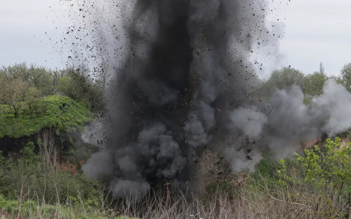 Ukrainian sappers explode anti-tank mines and other explosive materials found near the town of Bucha, on a military range outside Kyiv (Kiev), Ukraine, 13 April 2023, amid Russia's invasion