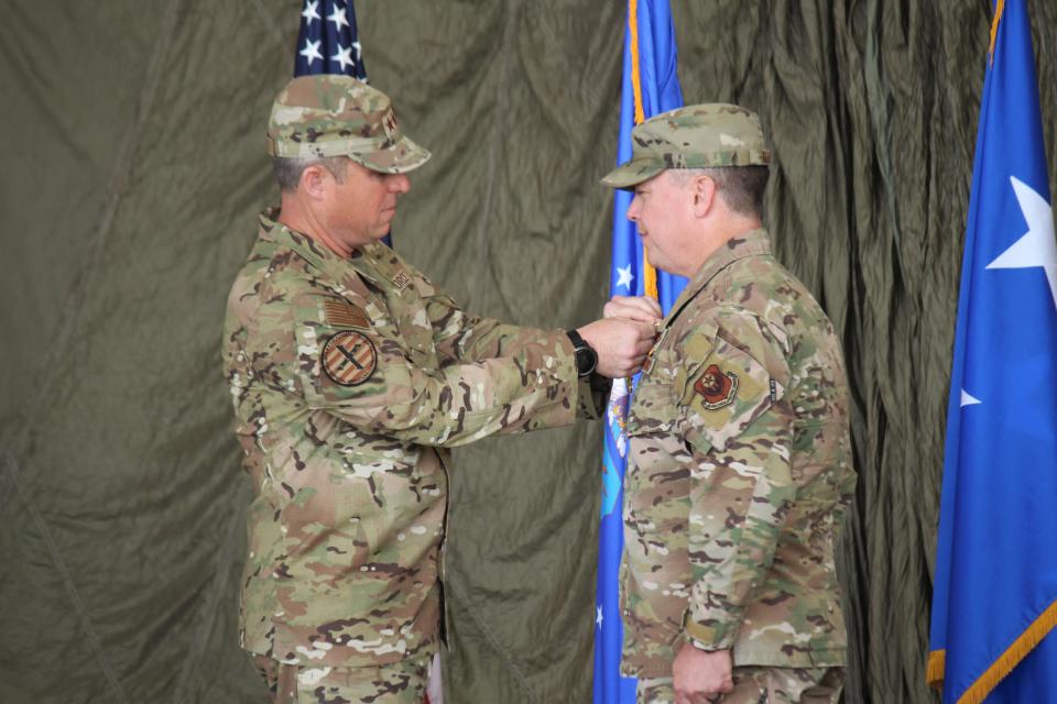 U.S. Air Force Lt. Gen. Michael E. Conley presents Col. Jeremy S. Bergin with a Legion of Merit medal during a change of command ceremony Monday, July 15, 2024 at Cannon Air Force Base, N.M.