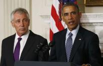 U.S. President Barack Obama (R) announces the resignation of Defense Secretary Chuck Hagel (L) at the White House in Washington, November 24, 2014. REUTERS/Larry Downing