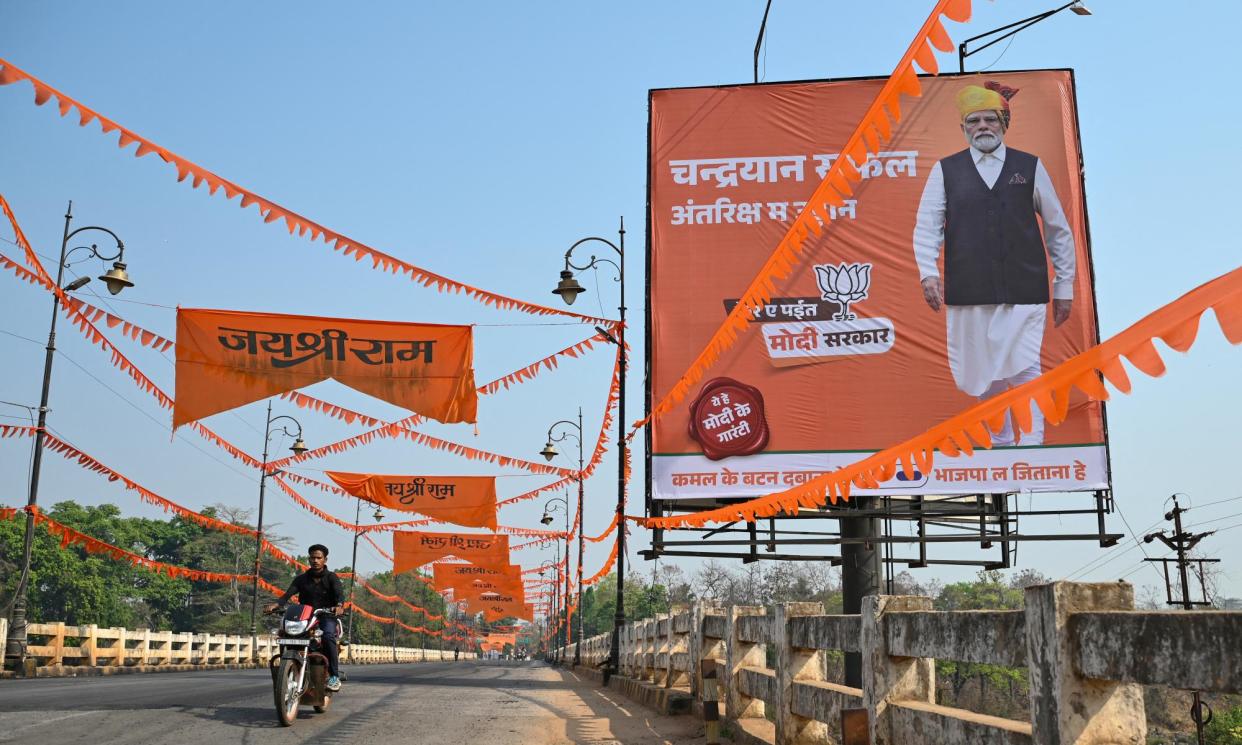 <span>A poster of Modi in Dantewada district in Chhattisgarh. Surveys show Modi to be India’s most popular political leader by a wide margin.</span><span>Photograph: Idrees Mohammed/AFP/Getty Images</span>